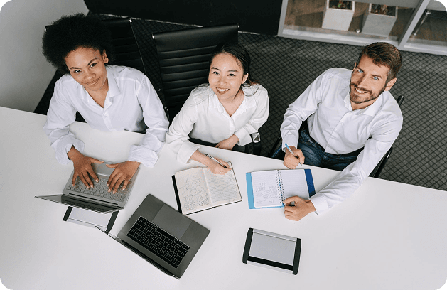 Diverse team collaborating at a desk