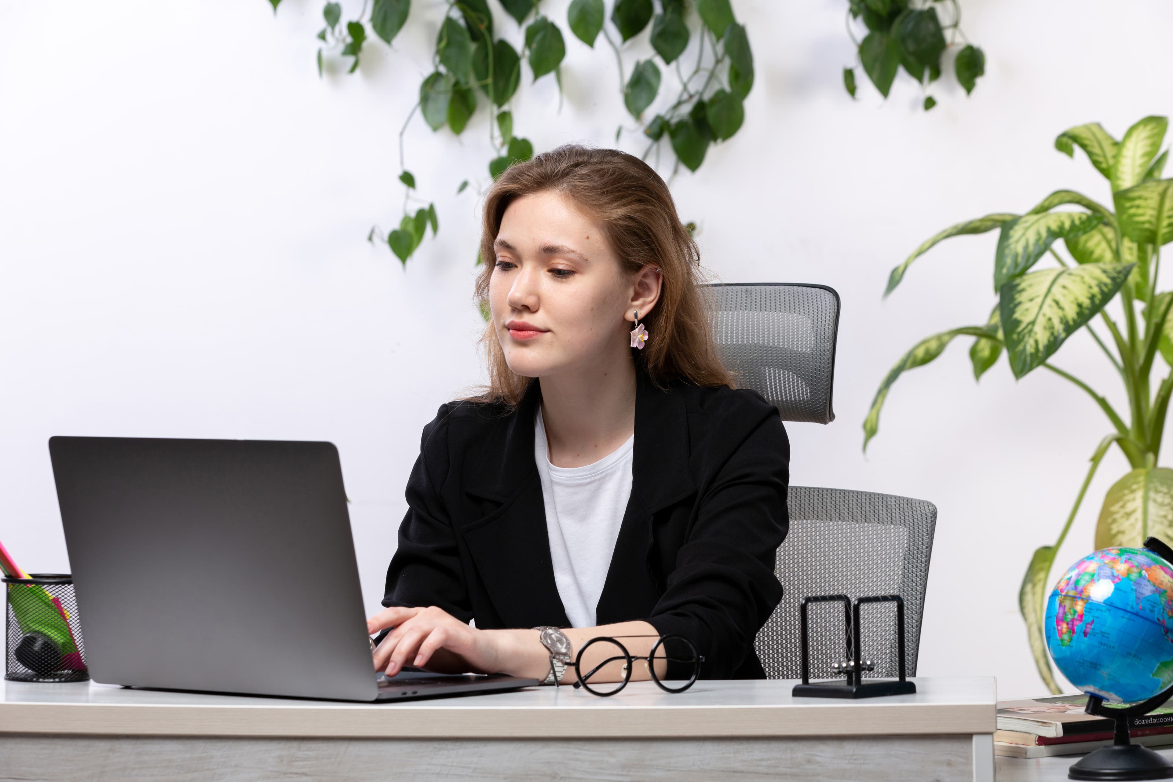 HR professional managing open roles on laptop